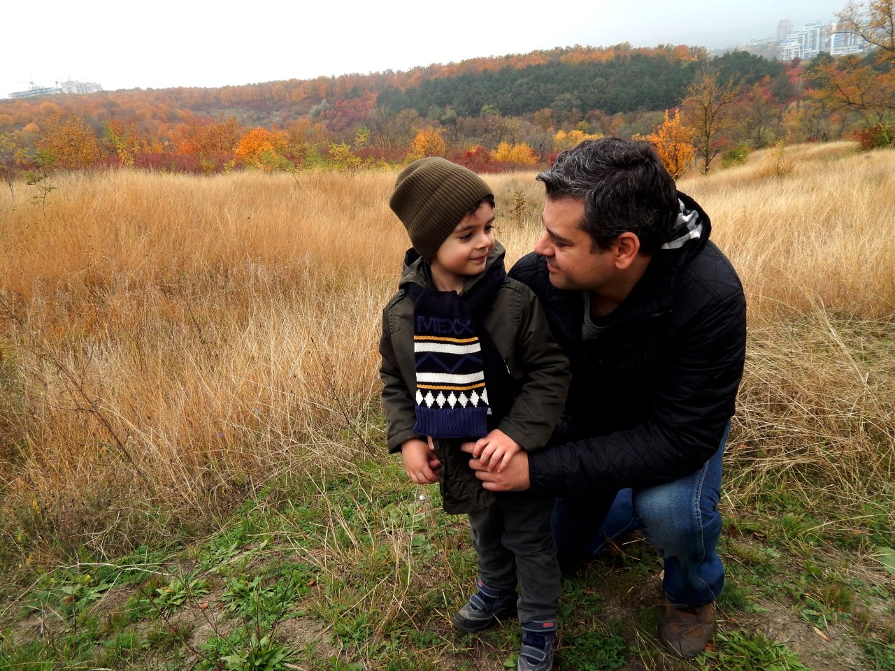 A father and his son in a field in Moldova.