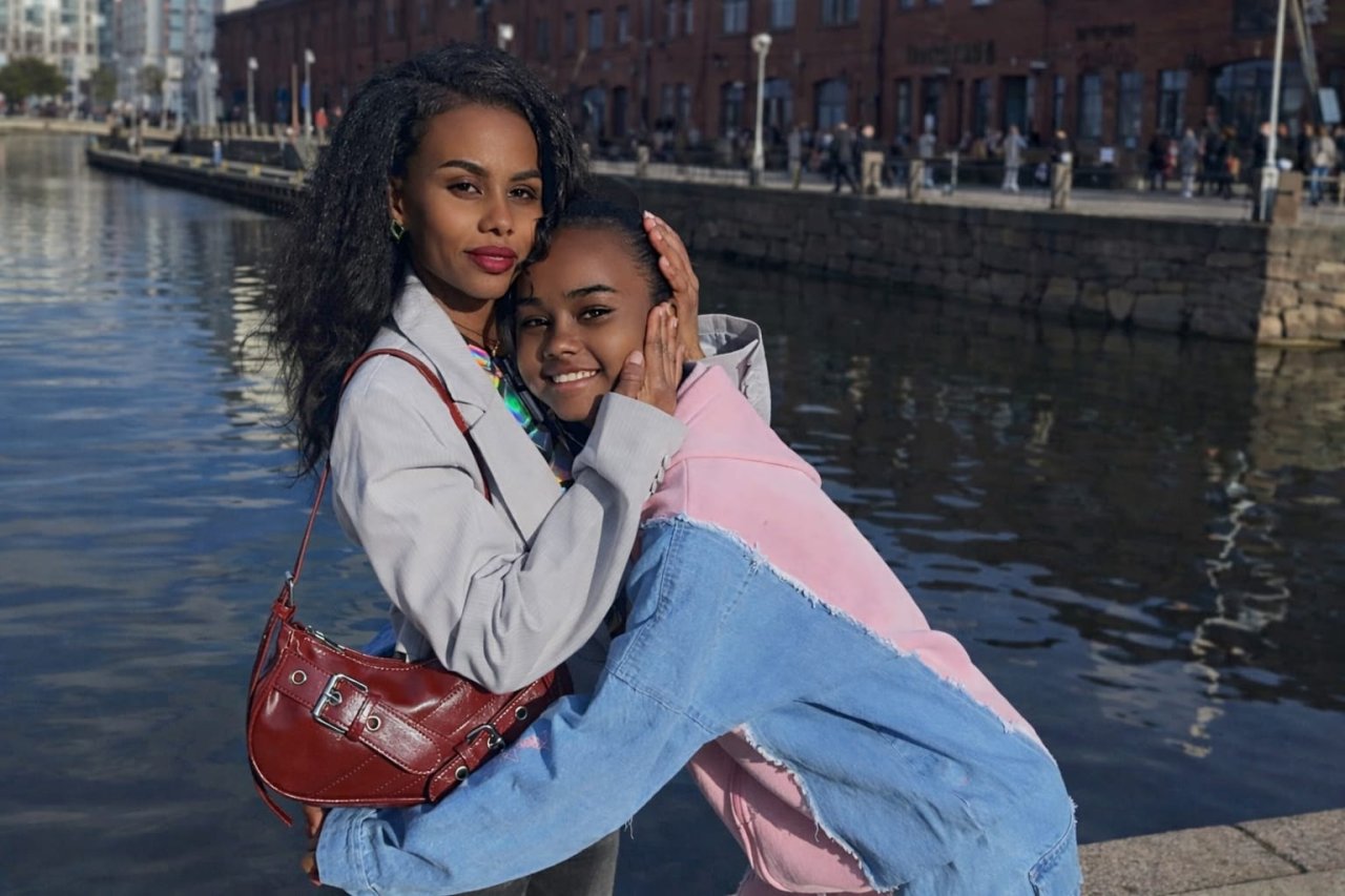 Two refugees in Egypt embrace.