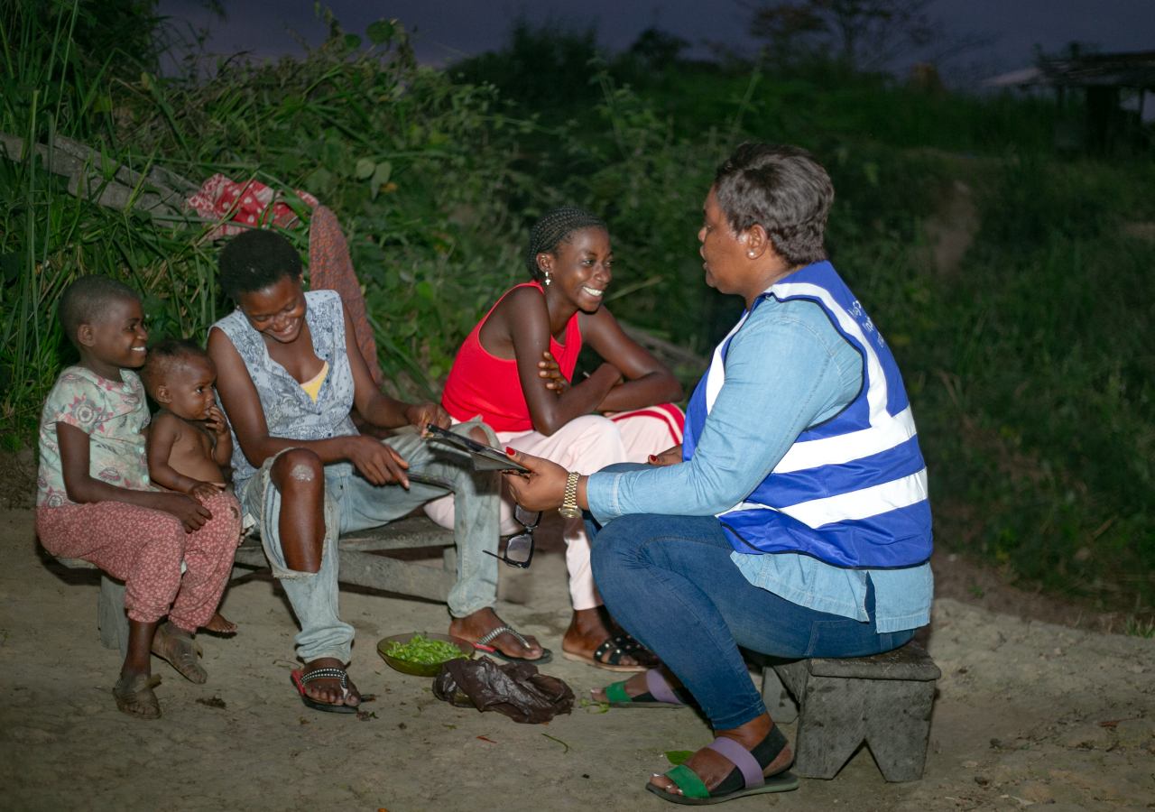 A UN Volunteer in Gabon interacts with local community members.