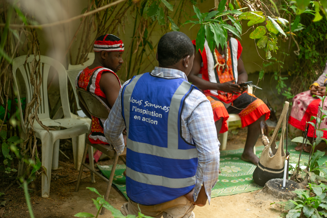 A UN Volunteer in Gabon interacts with local community members.