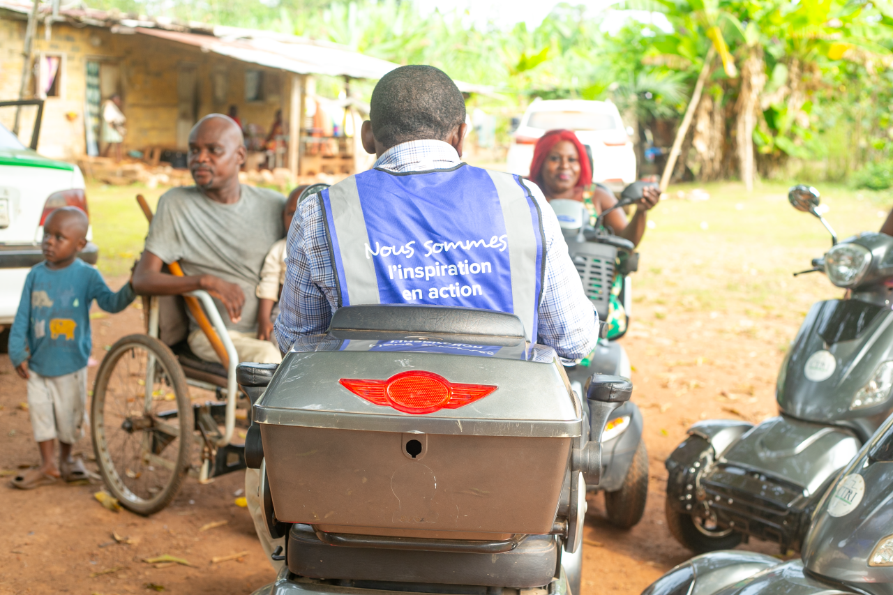 A UN Volunteer in Gabon interacts with local community members.