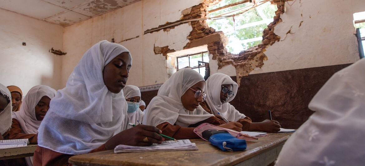 Girls attend a lesson in a partially destroyed classroom at a primary school in Khartoum state, Sudan.
