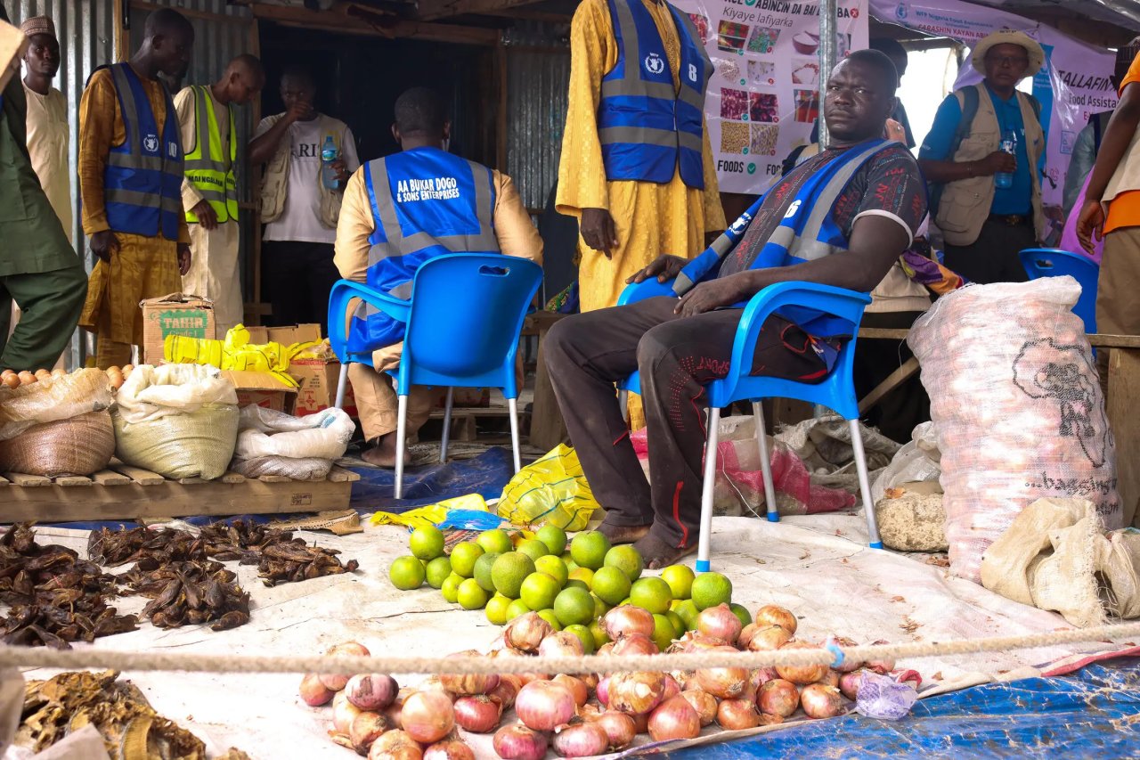 A WFP-registered retailer displays food items available to beneficiaries redeeming e-vouchers at a displacement camp in Ngala, Borno State.