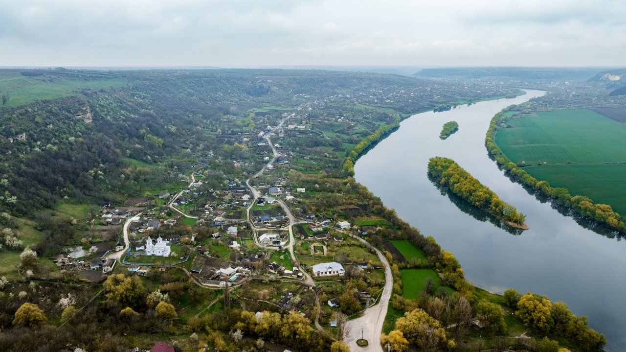 An aerial view of greenery and a town in Moldova.