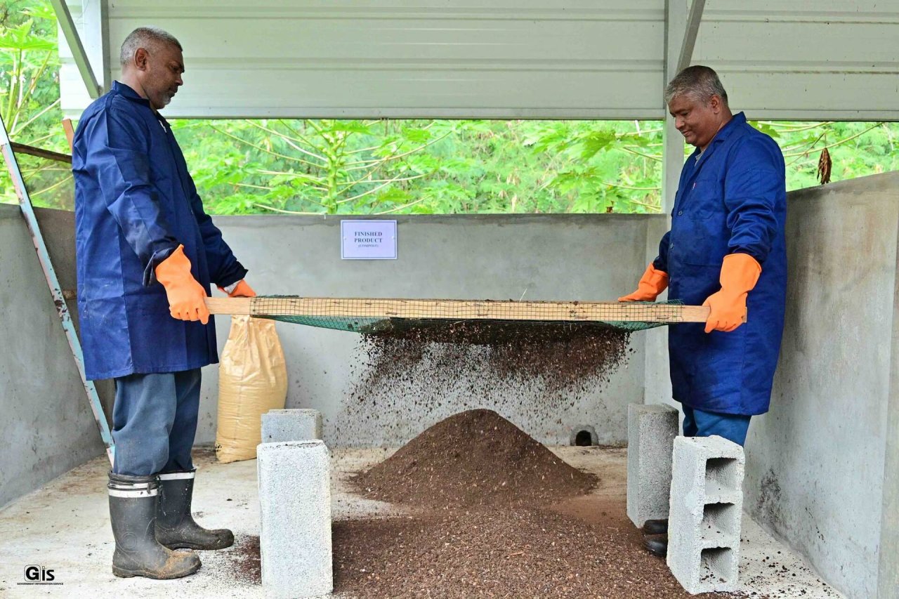 Two men in Mauritius process seaweed to be used for bio-fertiliser.