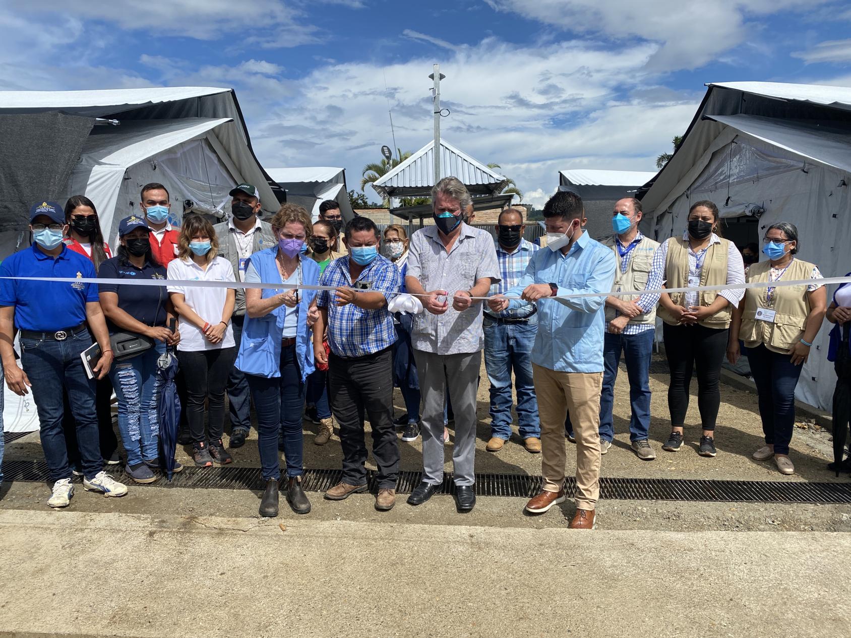 UN Resident Coordinator, UNICEF Representative and government representatives at the opening ceremony of a Temporary Rest Center.