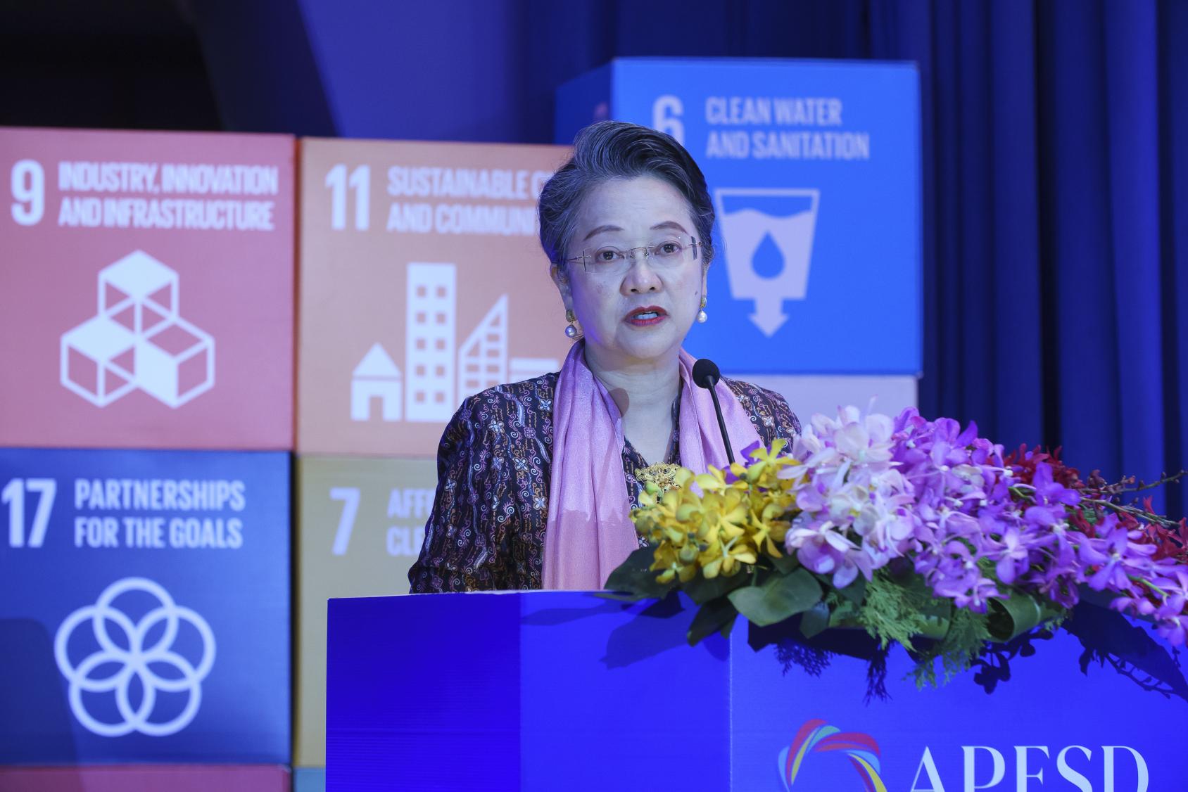 UN ESCAP Chief Arminda Alisjabanah speaking at the podium