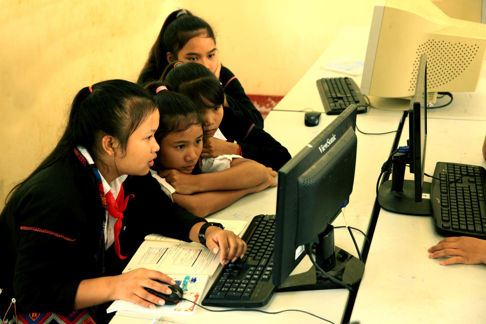 Schoolchildren using a computer.