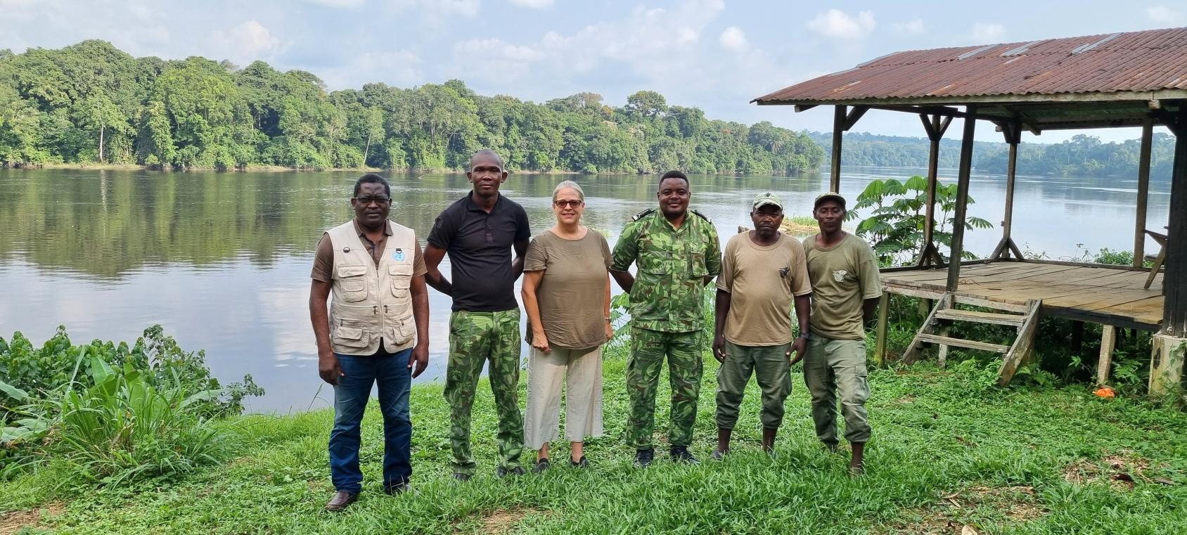 A group of six people, a woman in the center