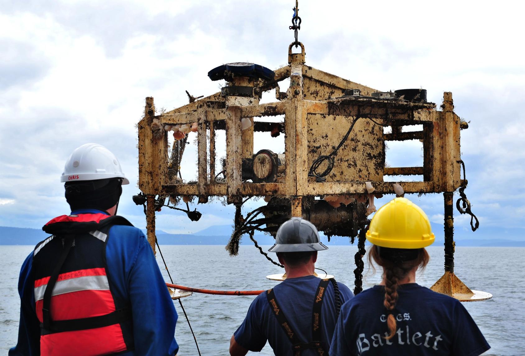 Three people with helmets