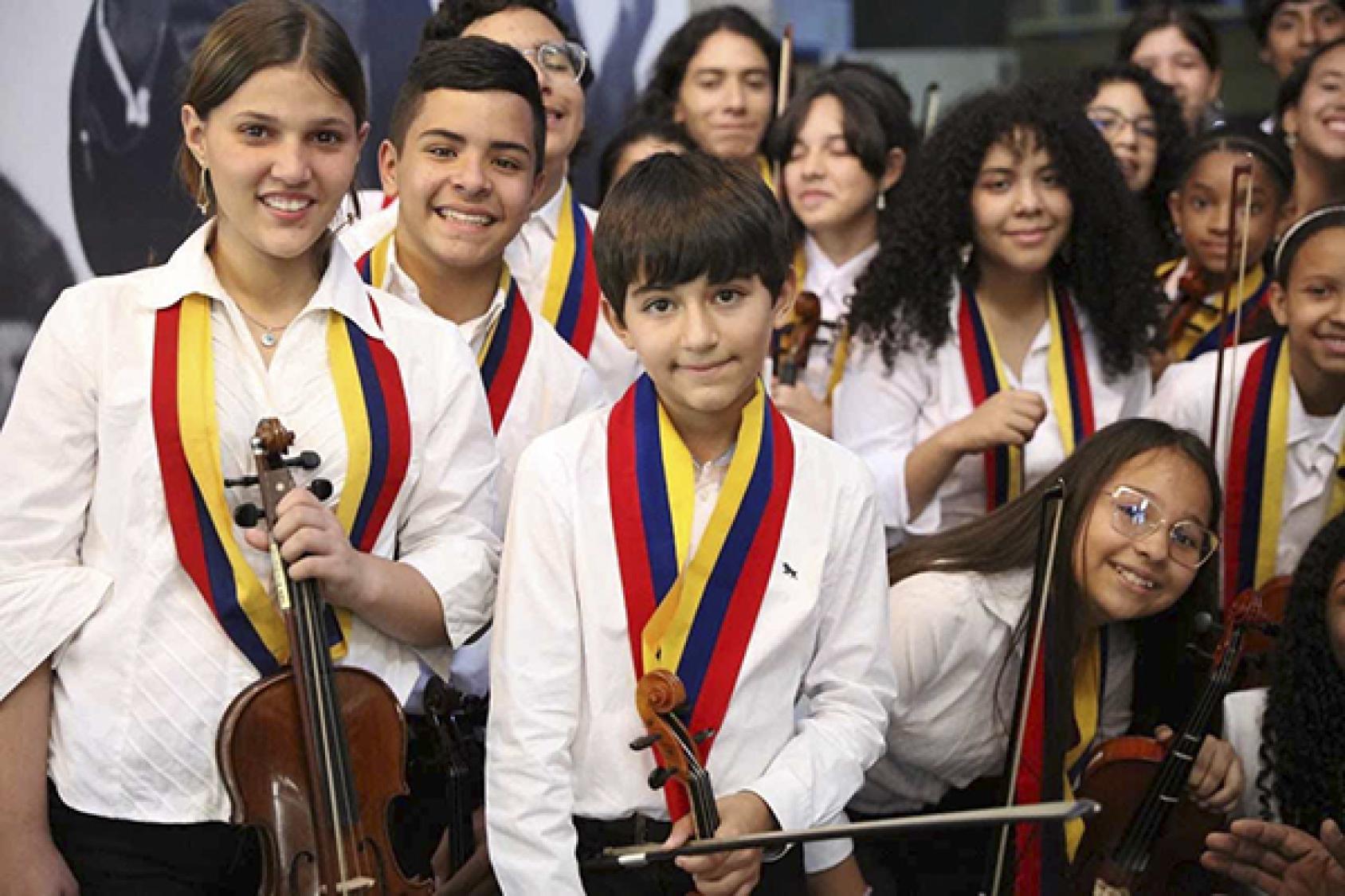 A group of young children with musical instruments