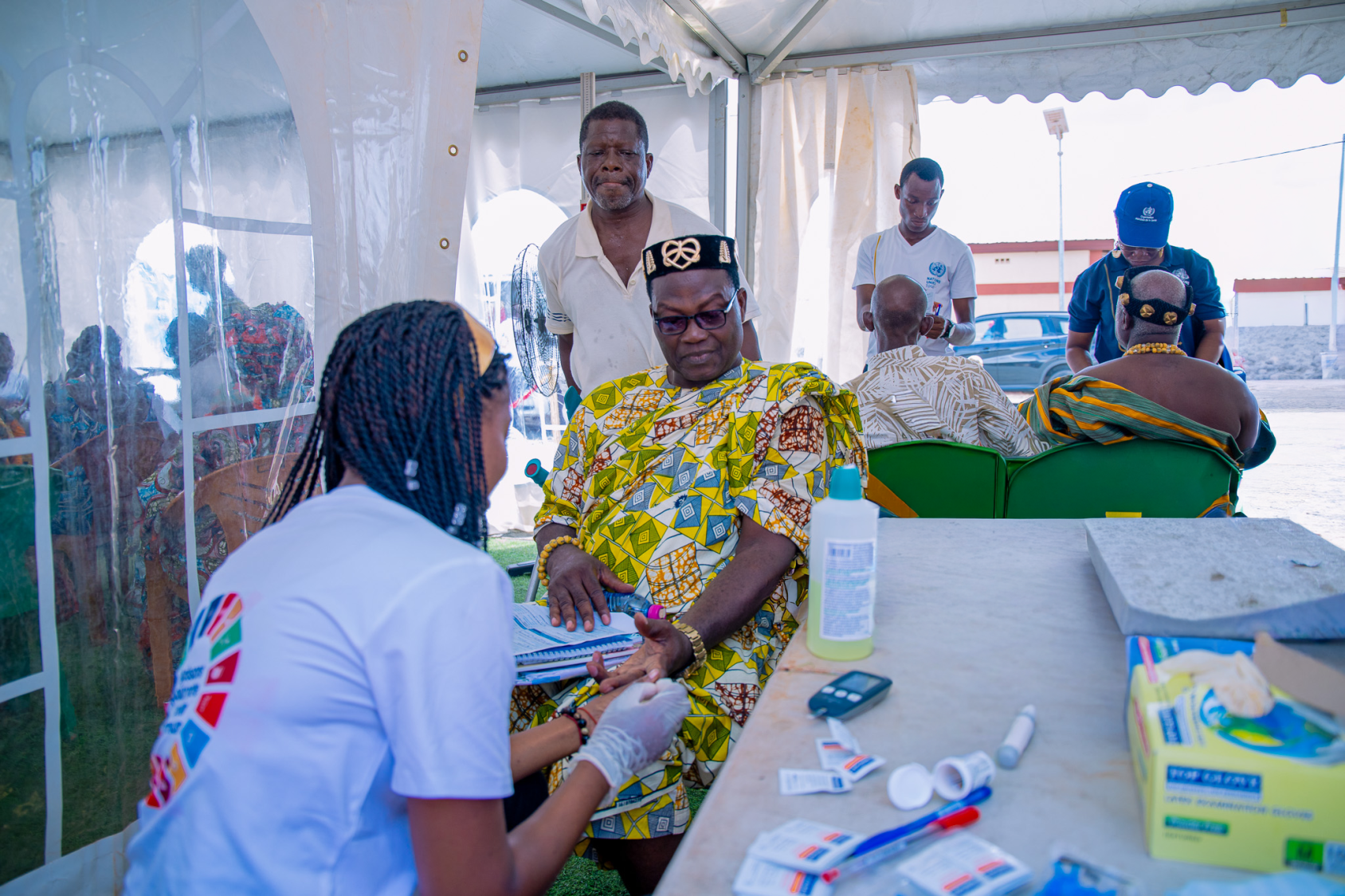 Health workers in Togo interact with patients.