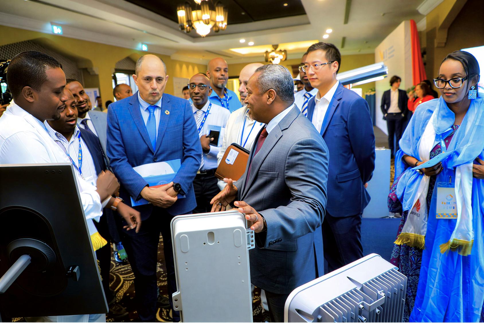 A high-level UN and a Government official meet with solar power entrepreneurs during a forum in Djibouti.
