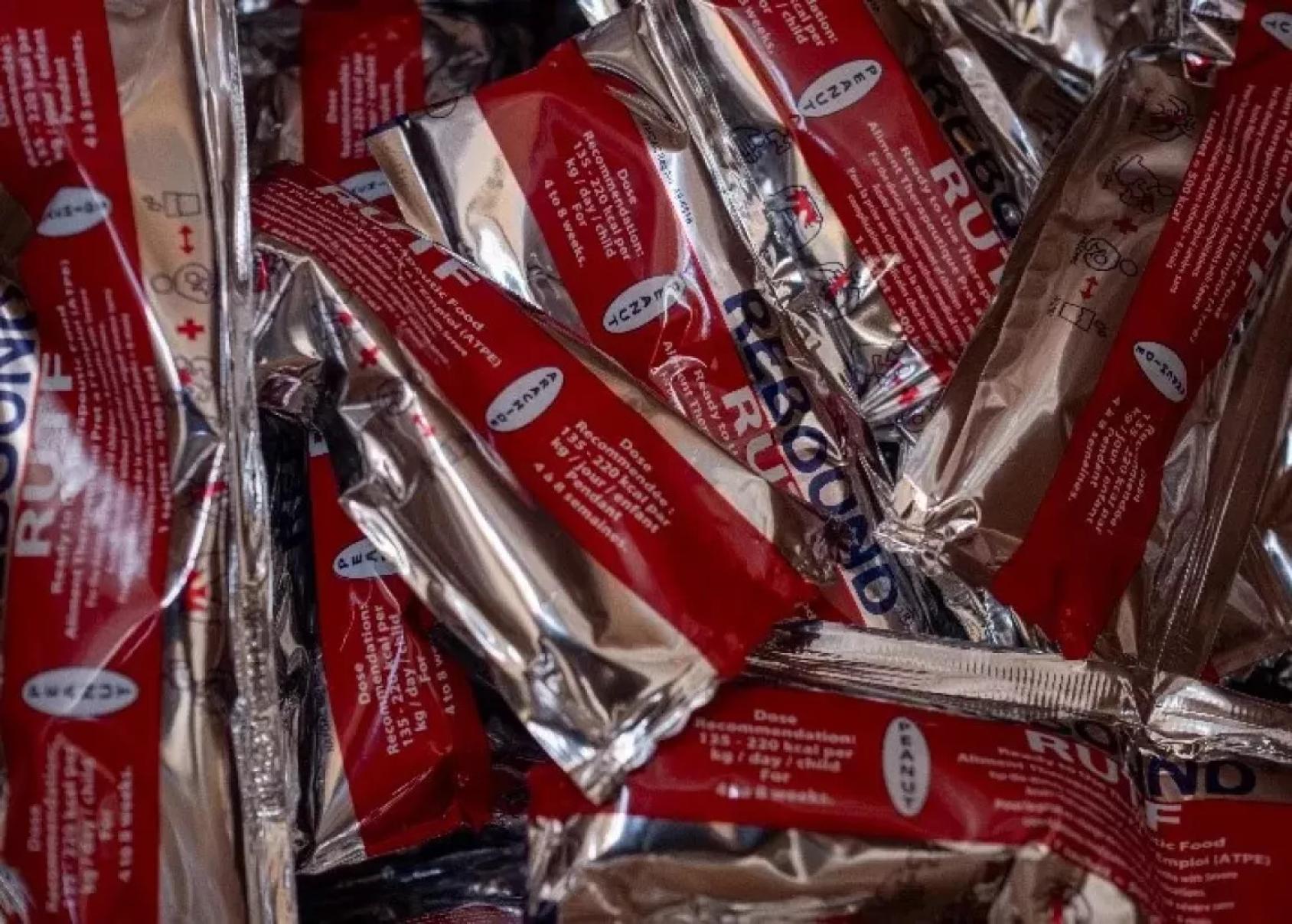 A pile of packages of Ready to Use Therapeutic Foods.