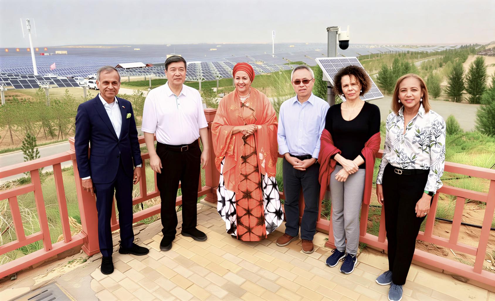 The UN Resident Coordinator for China with five other officials, including the Deputy Secretary-General.