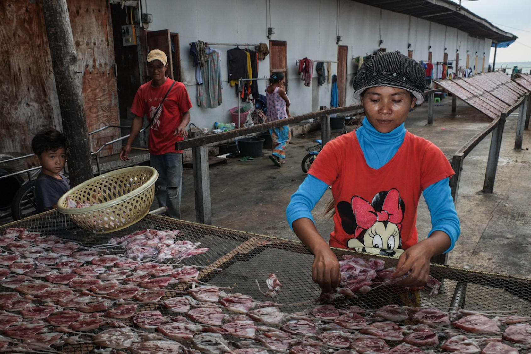 Woman packaging seafood