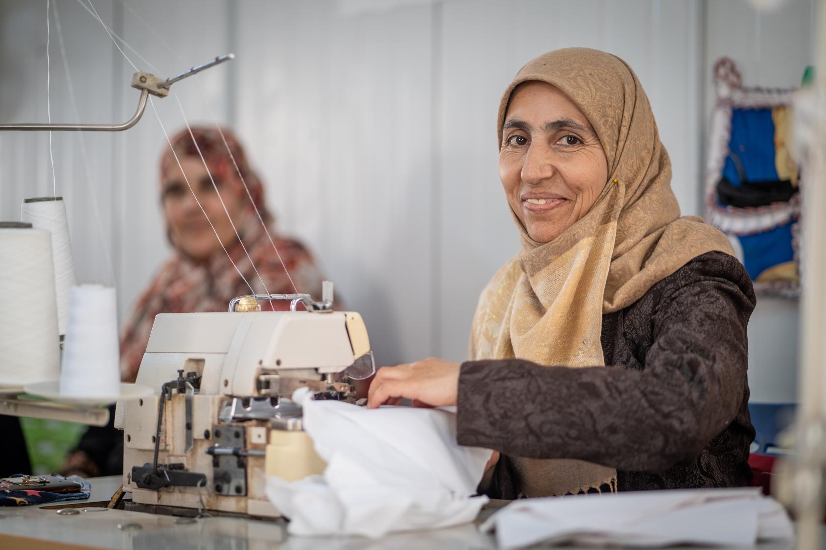 A woman in Jordan using a sowing machine.