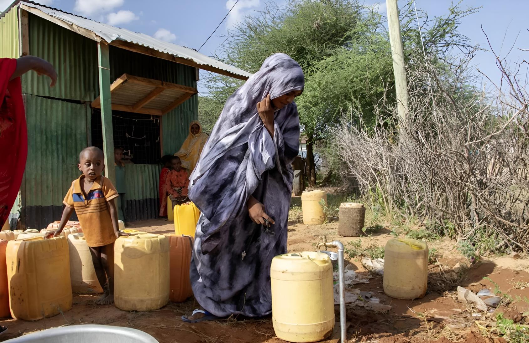 A woman in Kenya uses a borehole.