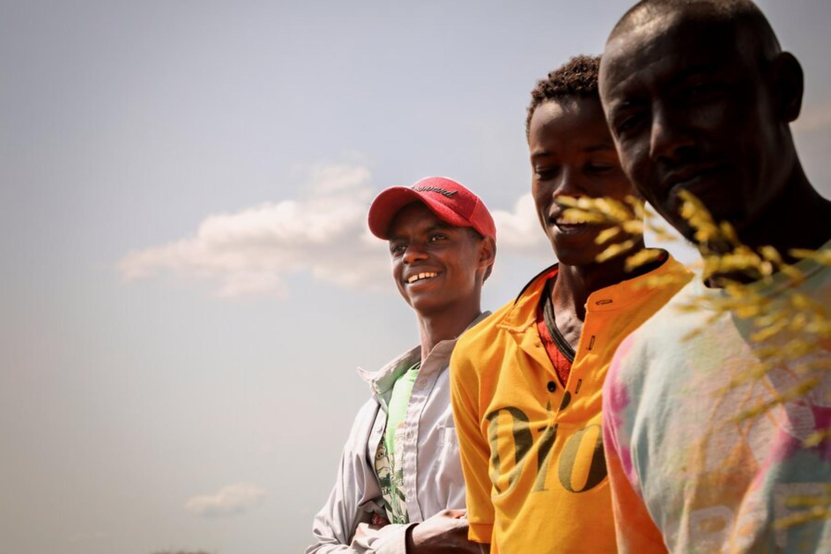 Three young farmers in Kenya.