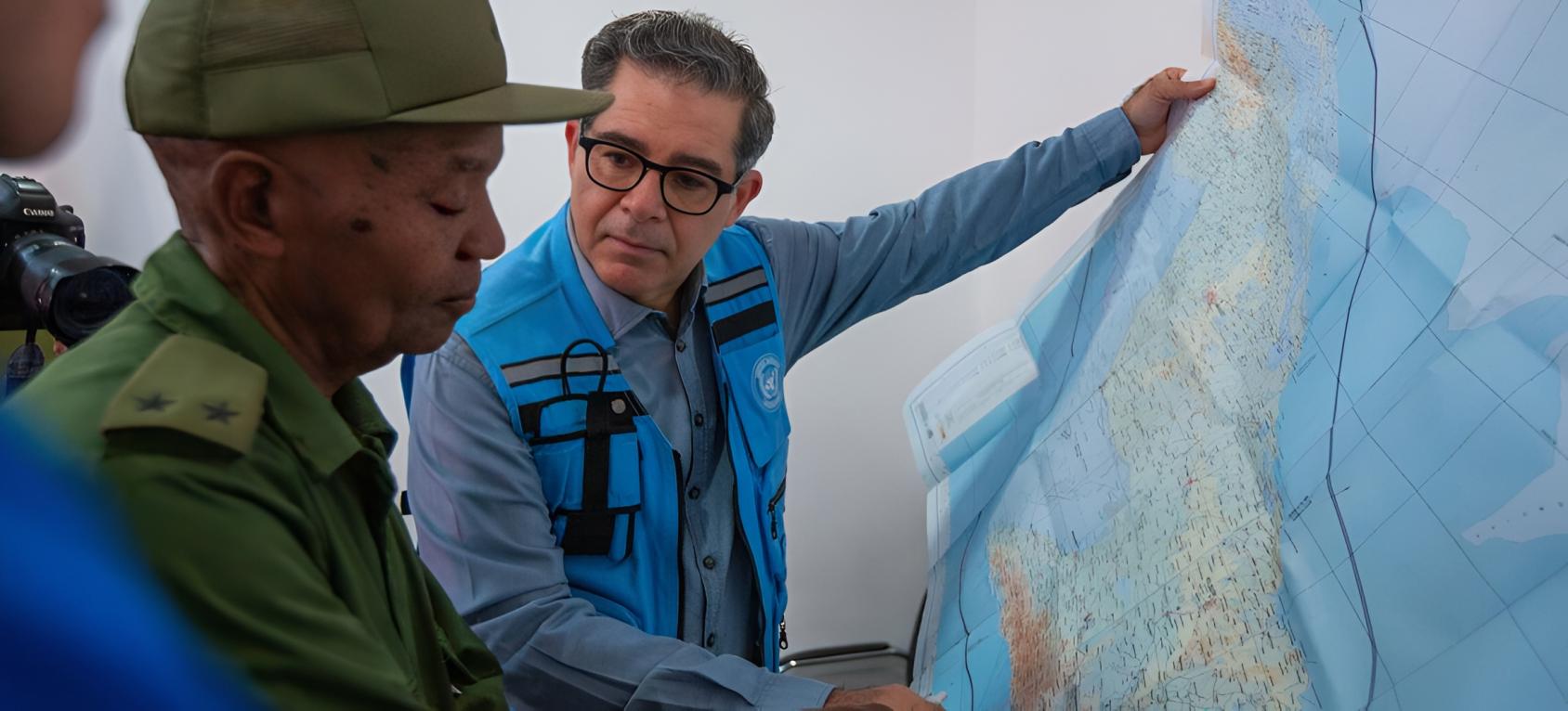The Resident Coordinator in Cuba talks to civil defence authorities following a disaster.