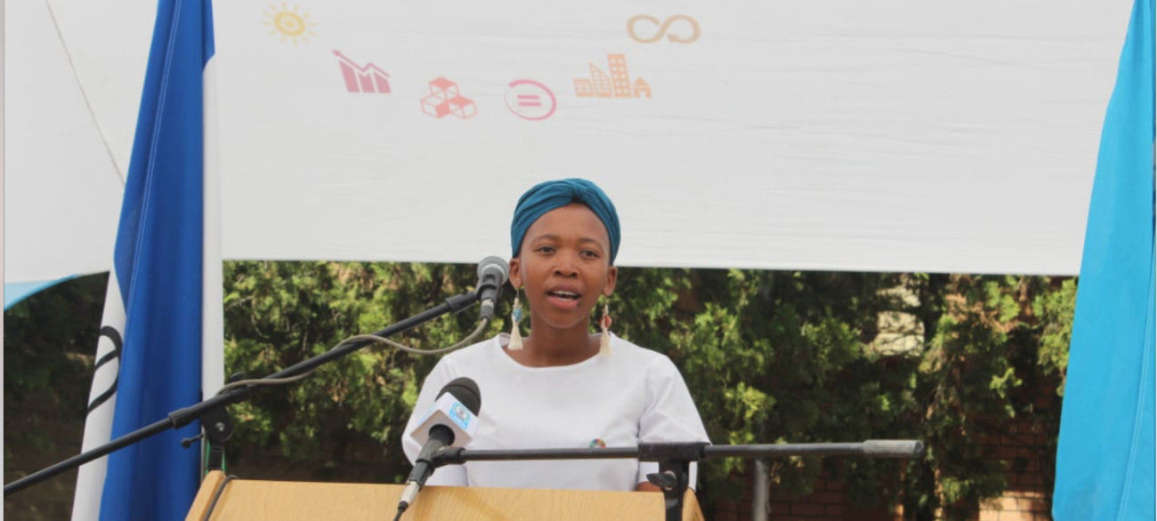 Young lady speaking at a podium