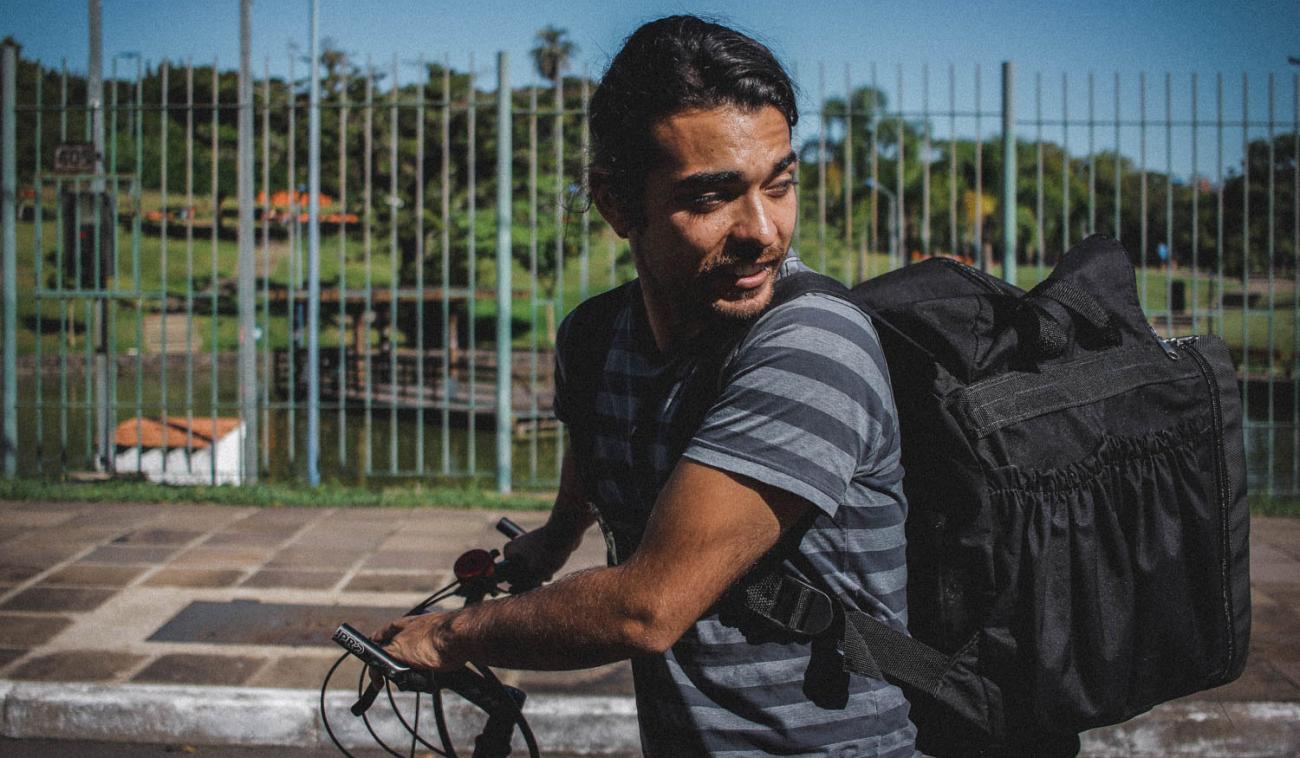 Matheus Martinez, 27, rides his delivery bike to his next destination.