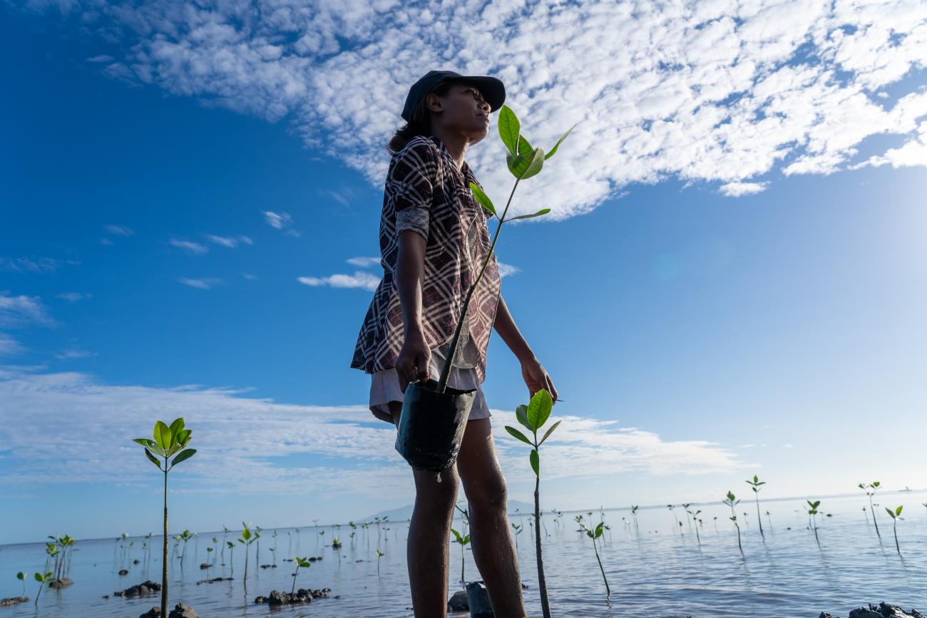 Woman standing in water in Timor Leste