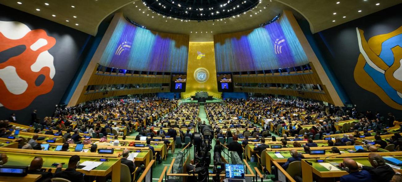 A wide angle view of the General Assembly room with seats lit up