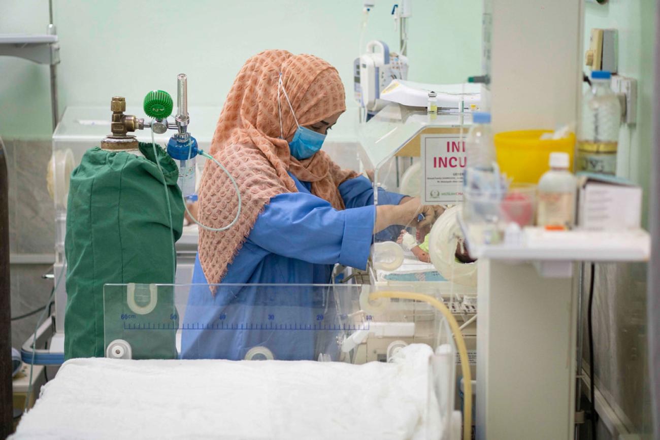 A female Yemeni nurse works in a hospital.