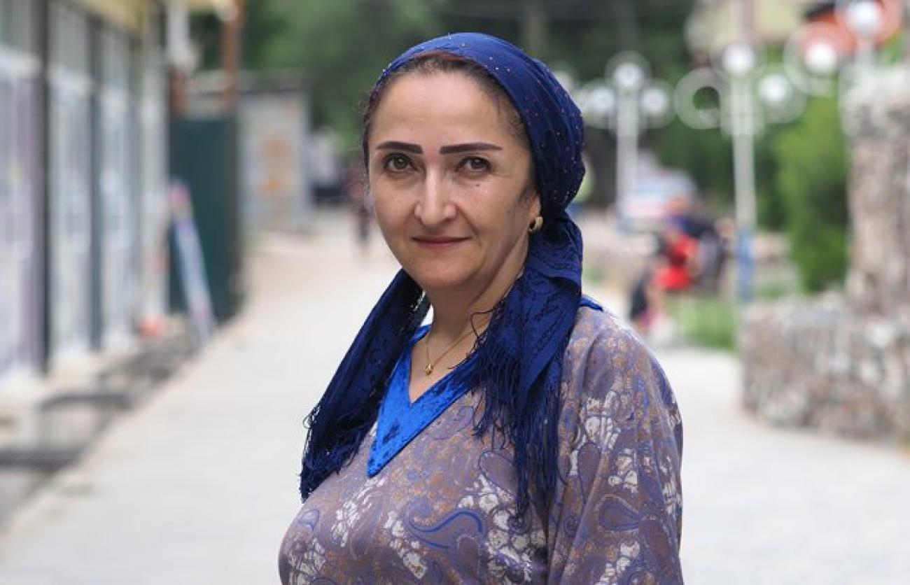 A Tajiki woman poses for a photo.