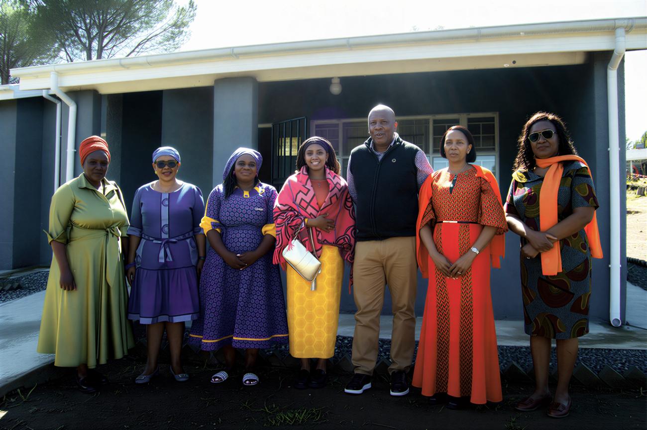 High-level UN officials and national partners in Lesotho pose for a photo together.