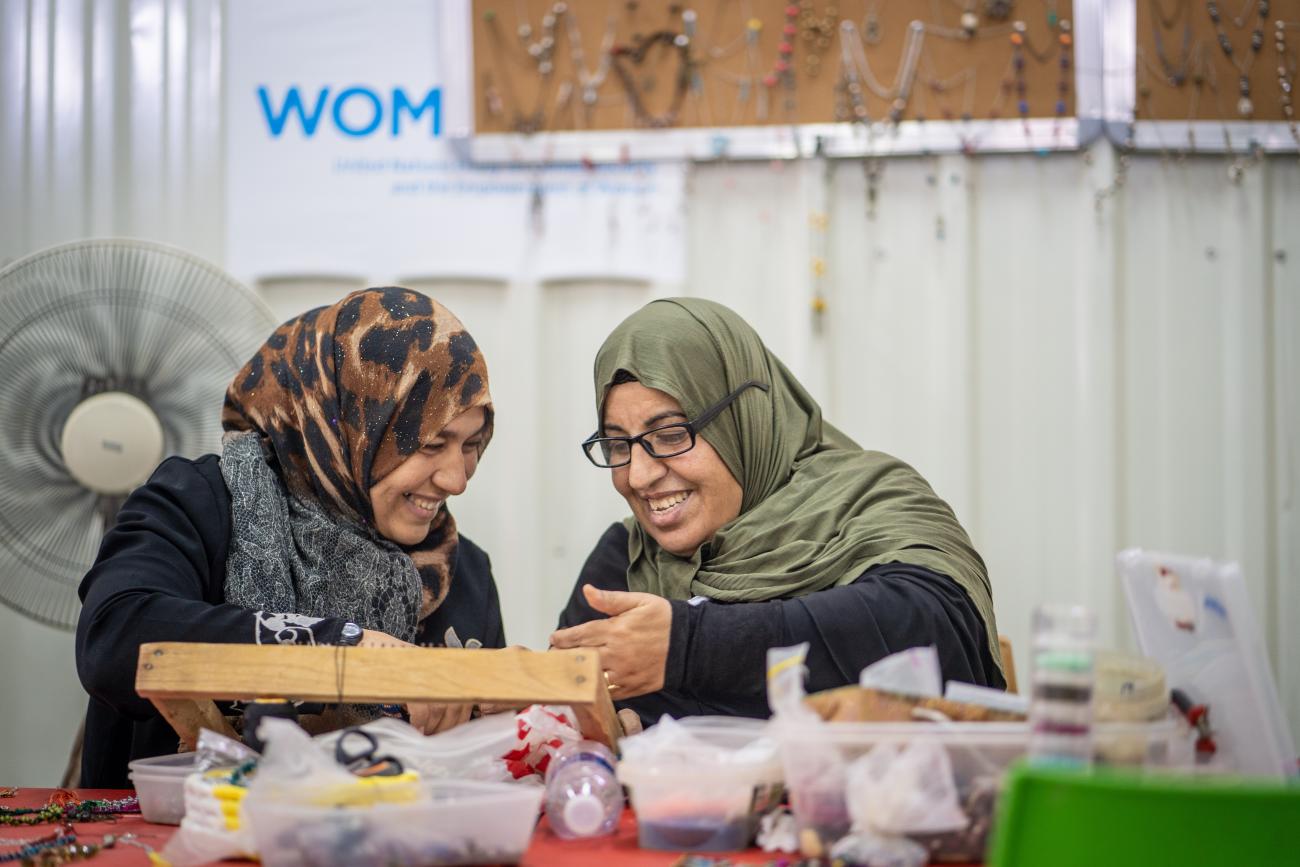 Two women in Jordan at a vocational training workshop.