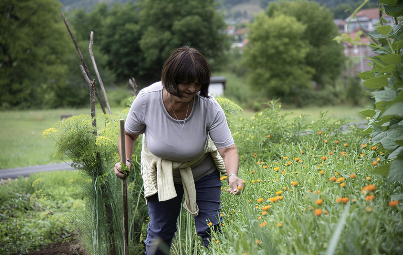 A woman farmer in Montenegro works in her field.