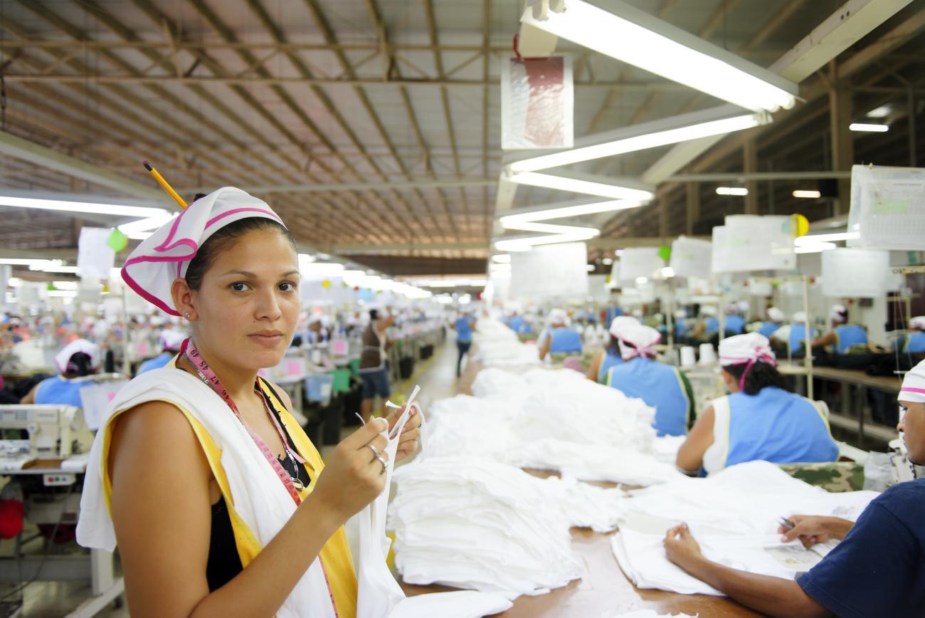 A woman works in a garment factory.