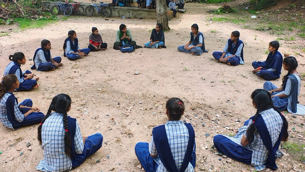 UN Volunteers in India sit in a circle.