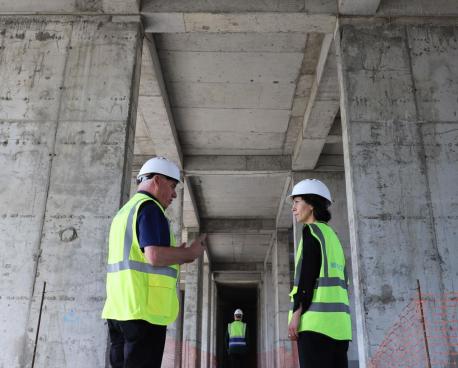 Two workers talking to each other