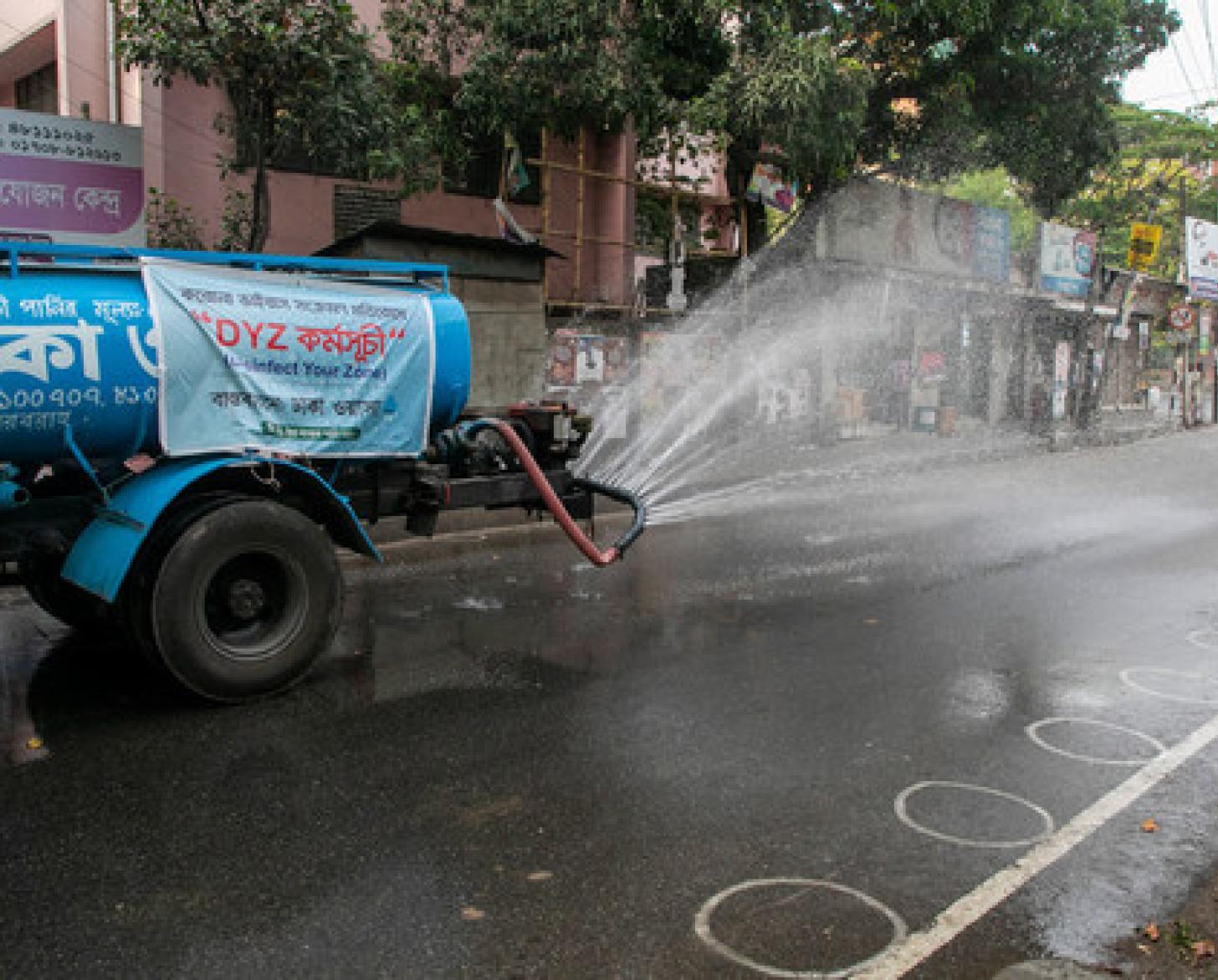 A municipal truck sanitizes the streets of Dhaka, Bangladesh in order to prevent COVID-19.
