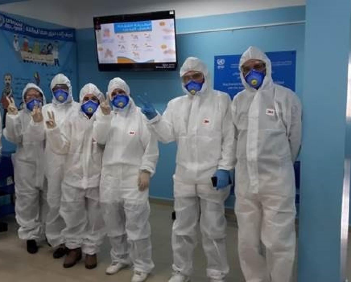 Medical staff at UNRWA's vital health centres proudly wear head-to-toe personal protective equipment. 