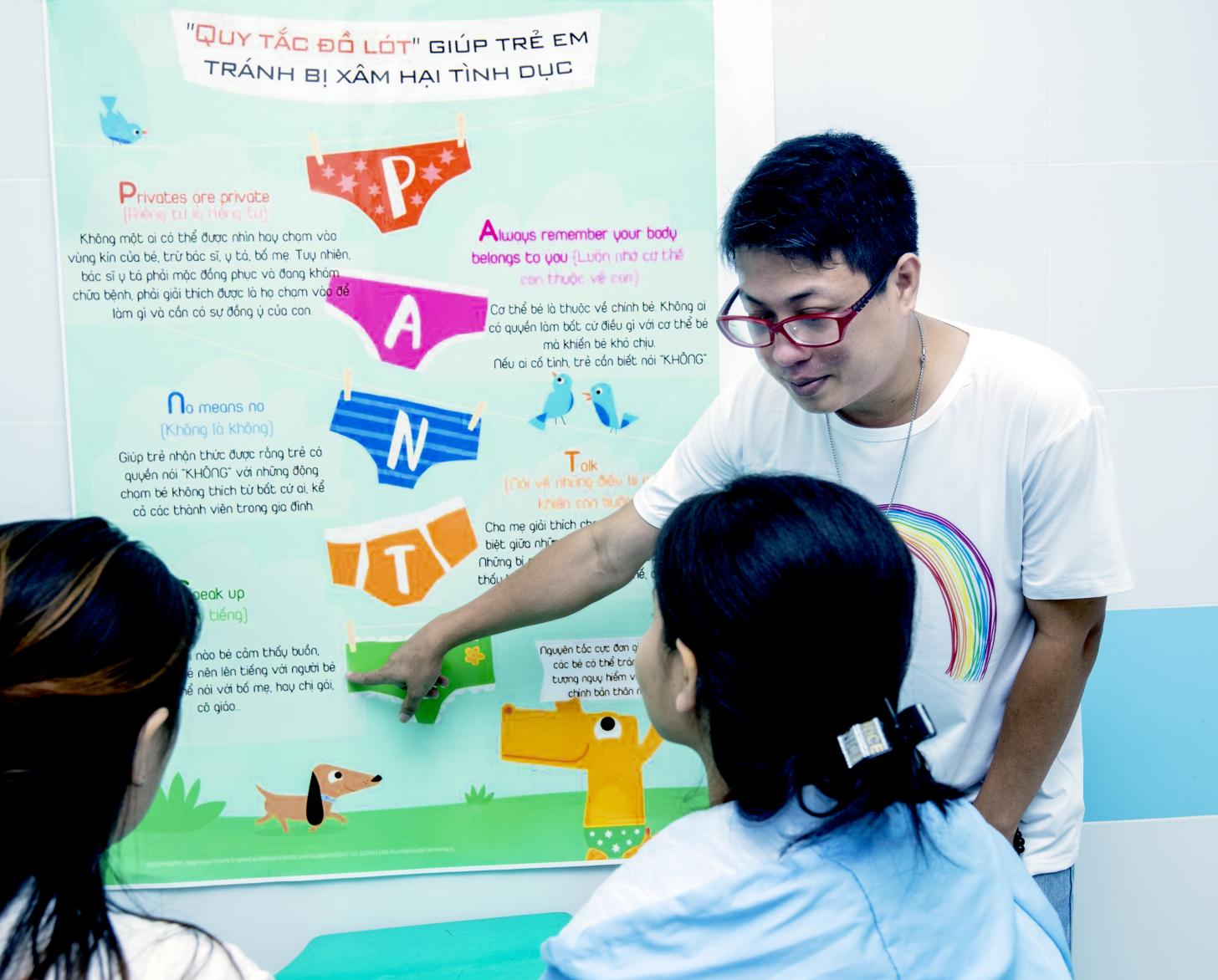 Dr. Thu is teaching two young girls the importance of consent and sexual abuse prevention.