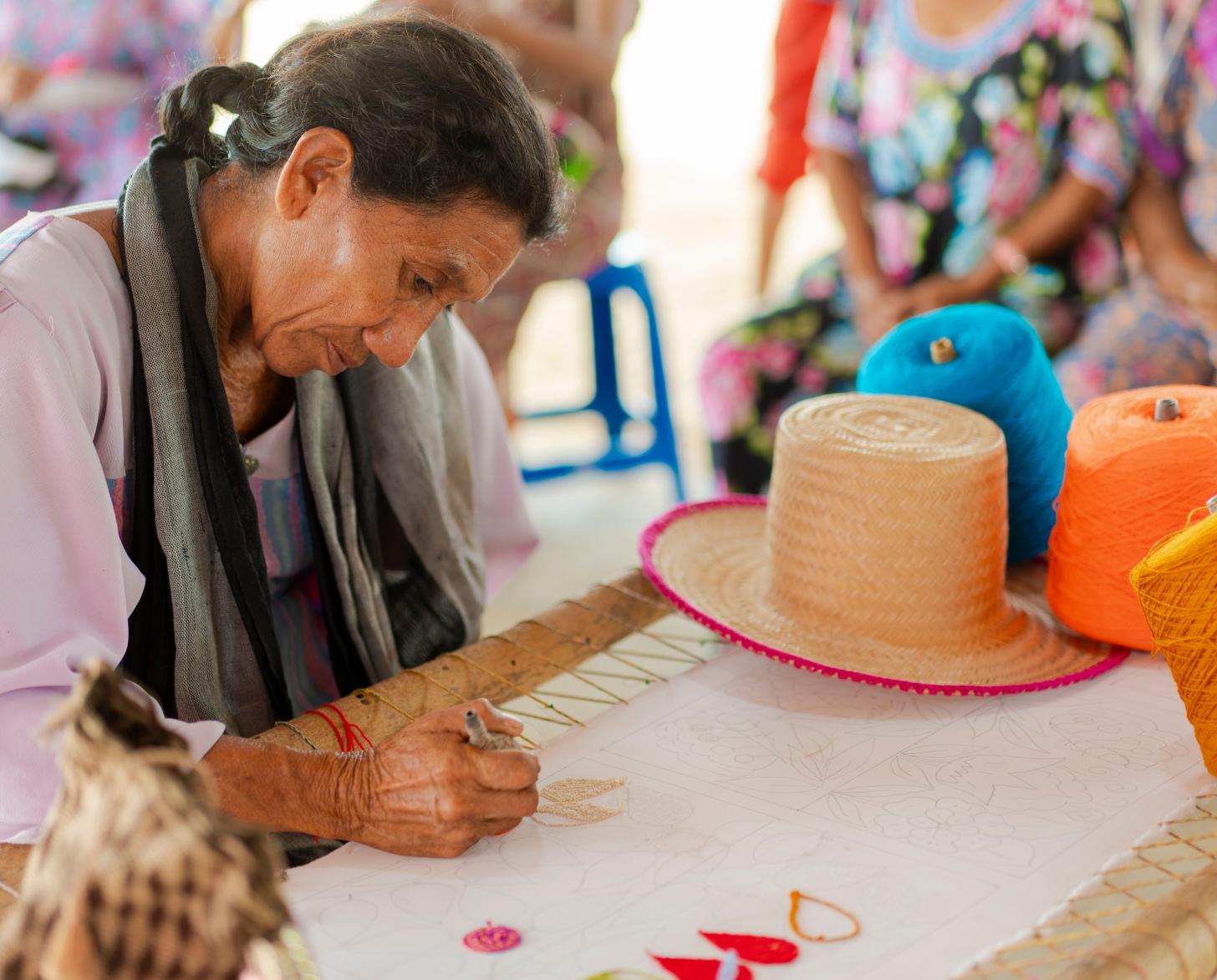 Flor Fuenmayor (52), creates designs at the Yarn Cone Bank 