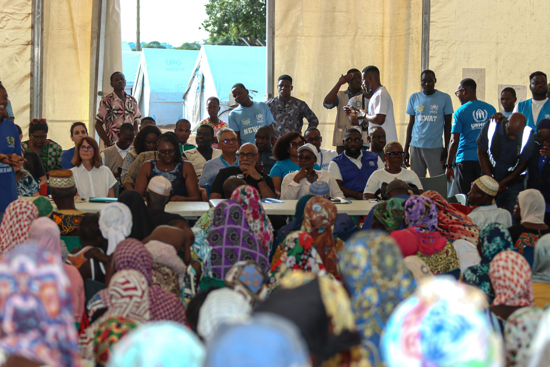 United Nations officials meet a group of asylum seekers at the Tarikom resettlement centre