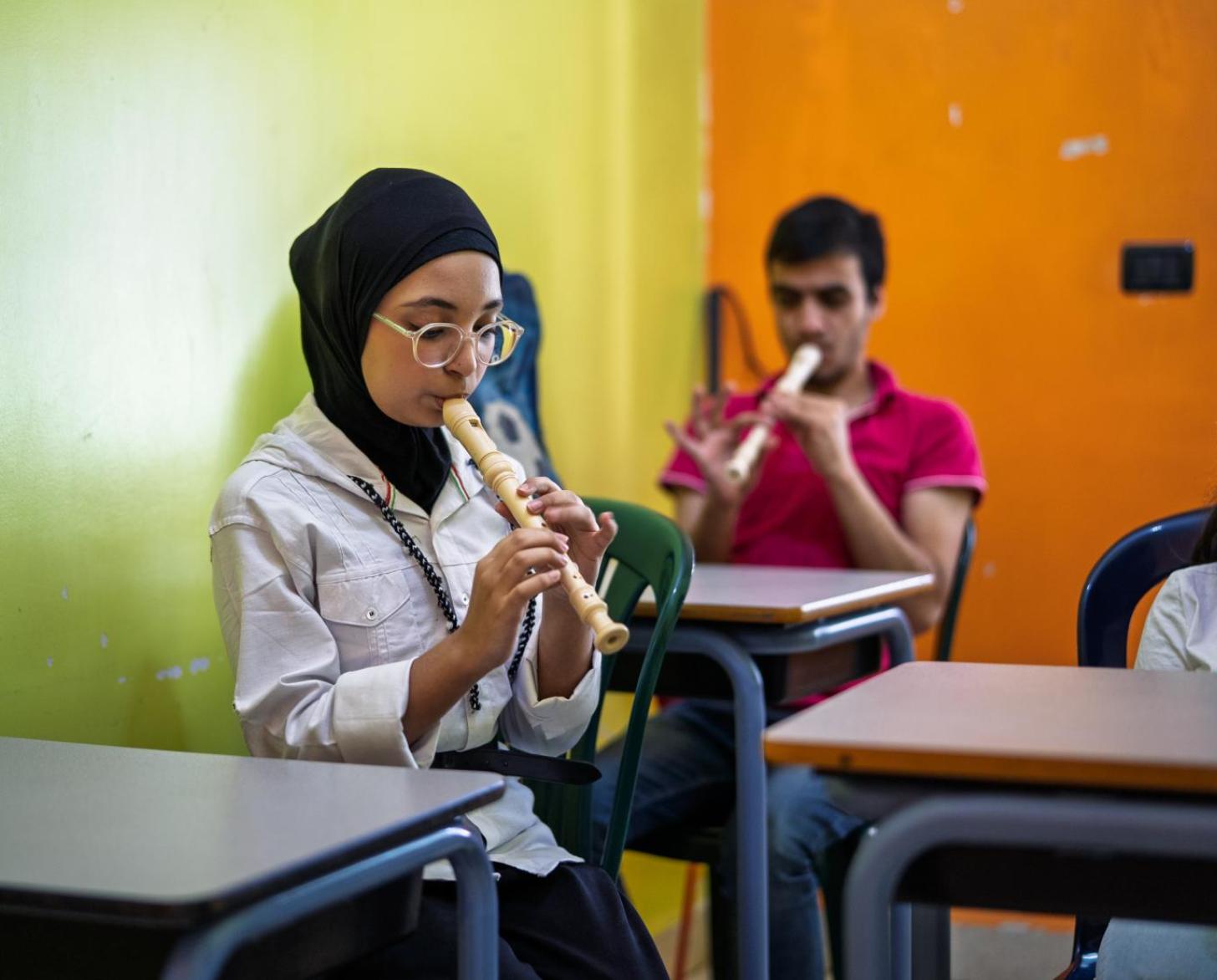 A young Lebanese girl plays the flute