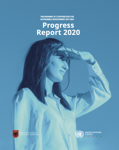 A woman with brown hair and a white dress shirt looks off into the distance. 