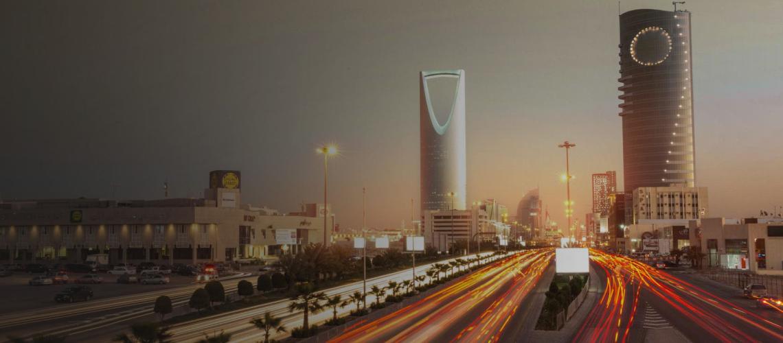 An scenic view of a city highway and buildings in Saudi Arabia.