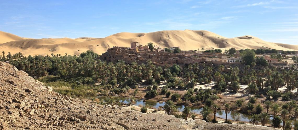 Taghit, Algeria, with its dunes and lush trees.
